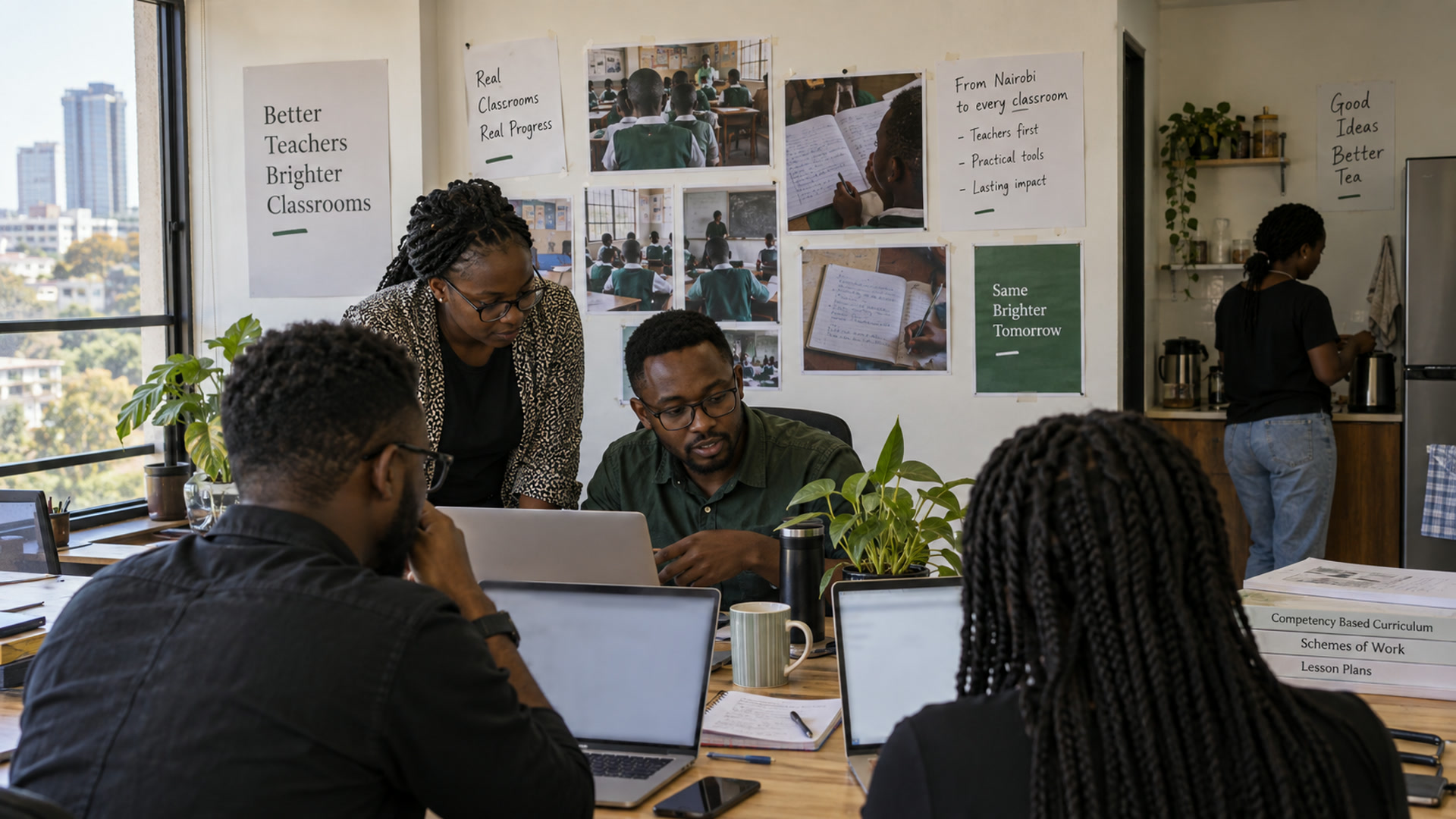A small product team working in a Nairobi office with school printouts on the wall.
