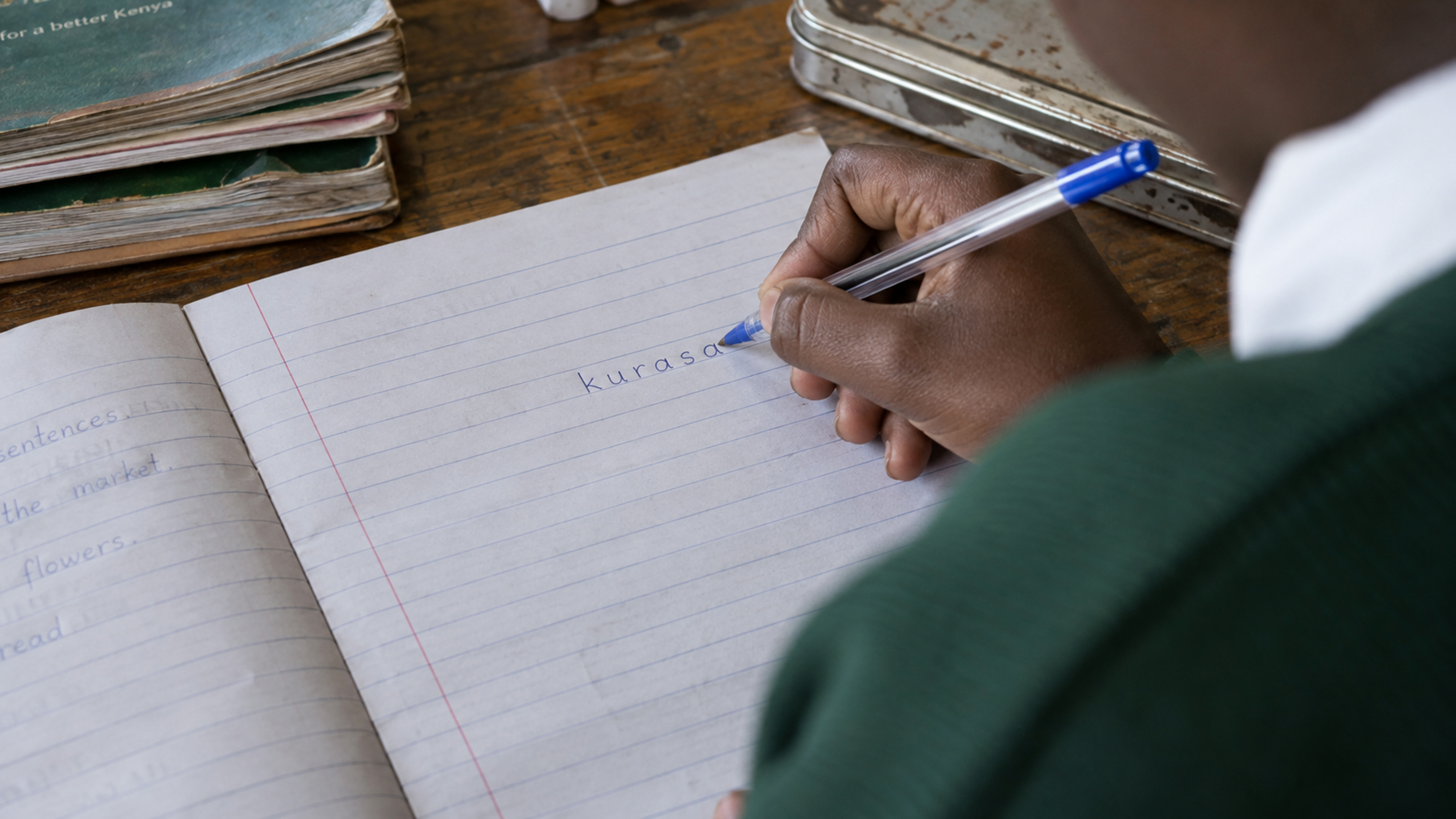 A handwritten exercise-book page with the word kurasa in ordinary handwriting.