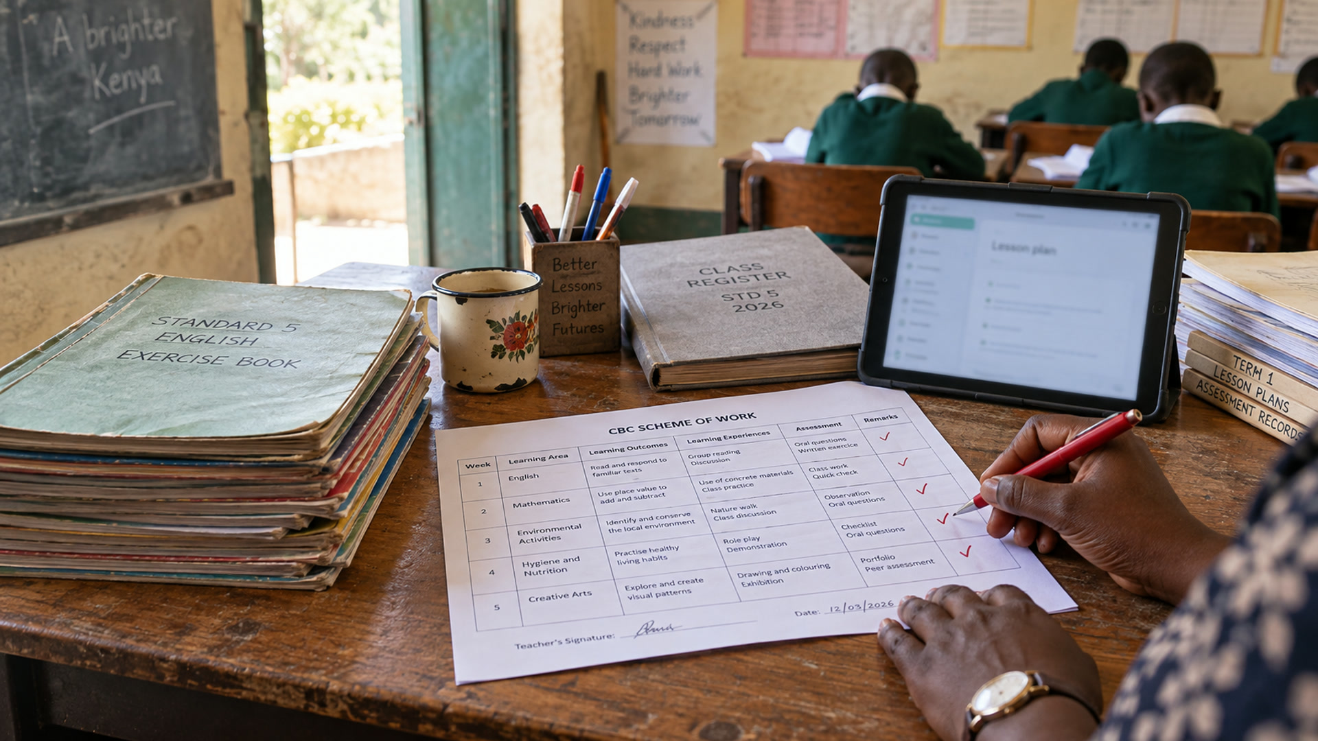 A teacher’s desk with a scheme of work, exercise books and a tablet open to lesson planning.