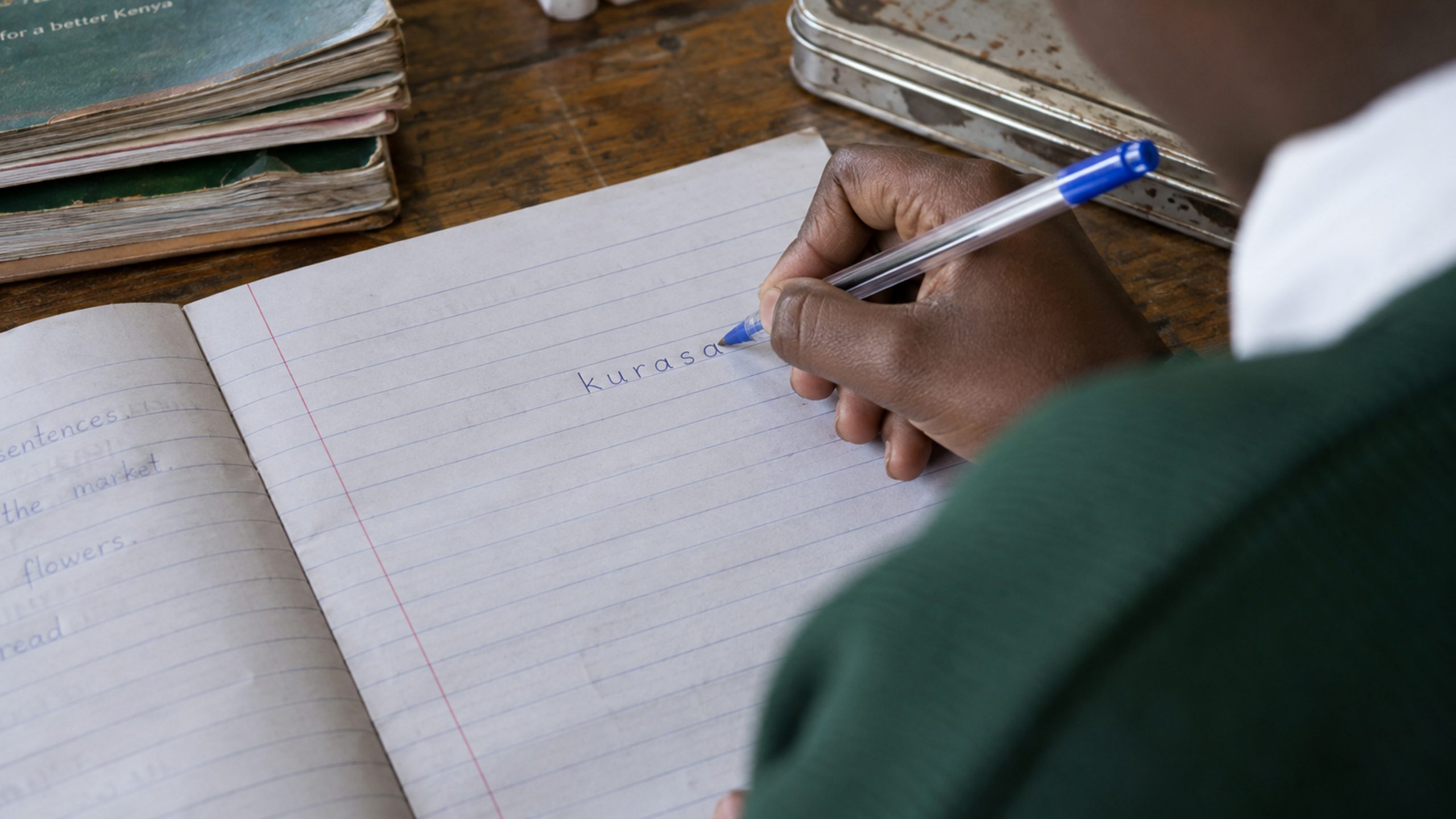 A handwritten exercise-book page with the word kurasa in ordinary handwriting.